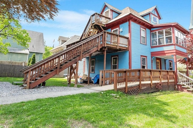 128 7th St, Montague, MA 01376 - back of property featuring stairs, a wooden deck, and a lawn