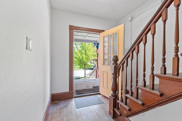 128 7th St, Montague, MA 01376 - entrance foyer with hardwood / wood-style flooring, stairway, and baseboards