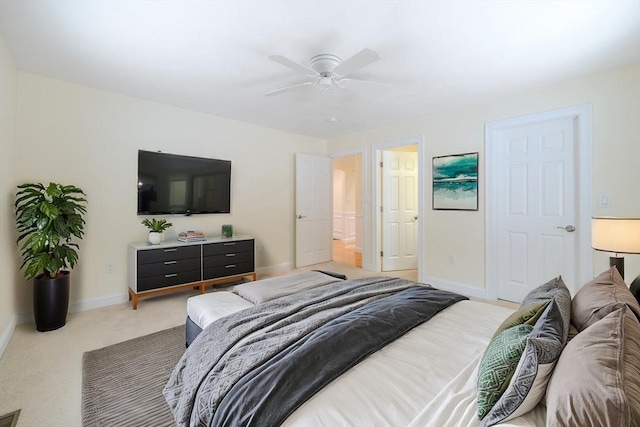 bedroom with ceiling fan, carpet flooring, and baseboards