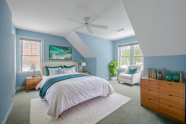 bedroom with light colored carpet, visible vents, and baseboards