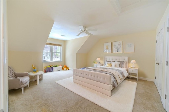 bedroom featuring vaulted ceiling, baseboards, a ceiling fan, and light colored carpet