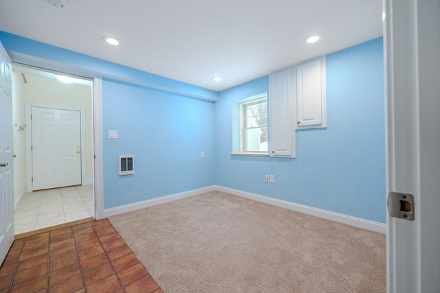 unfurnished room with recessed lighting, light carpet, and baseboards