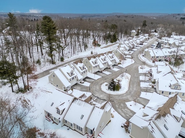 snowy aerial view with a residential view