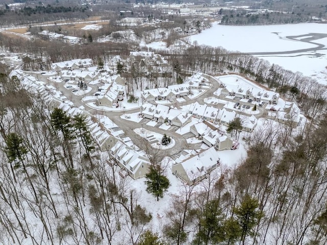 snowy aerial view featuring a residential view