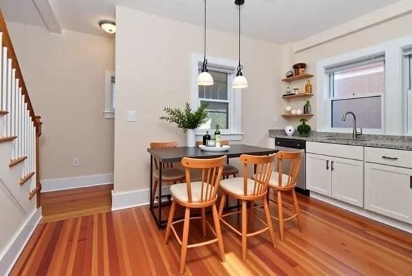 34 Channing St Unit C, Newton, MA 02458 - dining area featuring baseboards, wood finished floors, and stairs