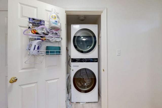 laundry area with laundry area and stacked washer and clothes dryer