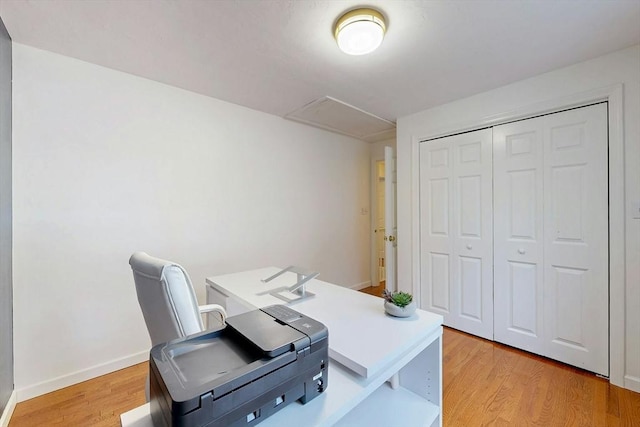 home office featuring baseboards and light wood-style floors