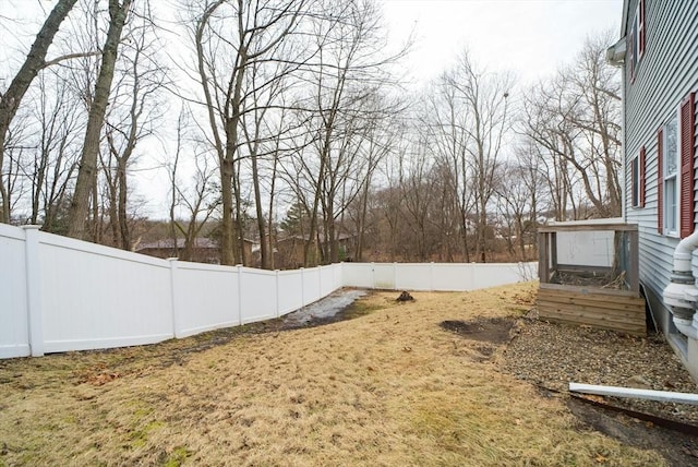 view of yard with a fenced backyard