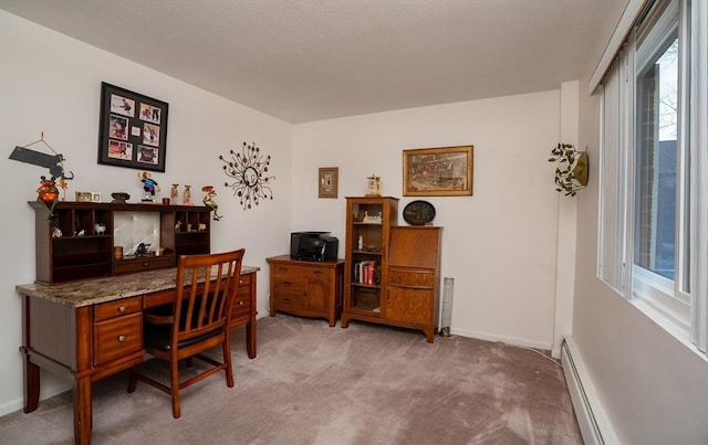 office with light colored carpet and a baseboard radiator