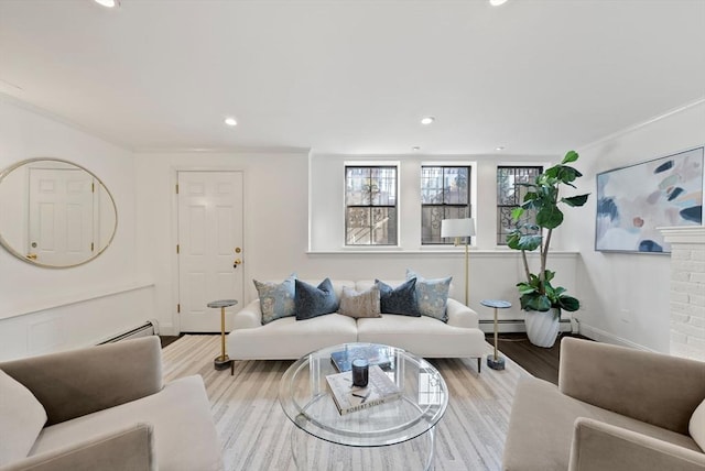 living room with recessed lighting, baseboards, light wood finished floors, and a baseboard radiator