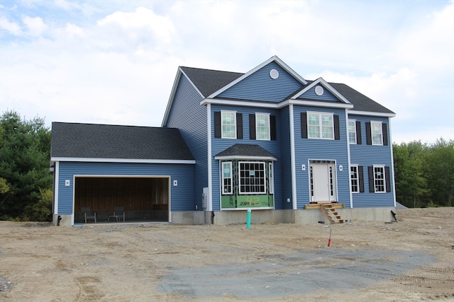 colonial home featuring a garage