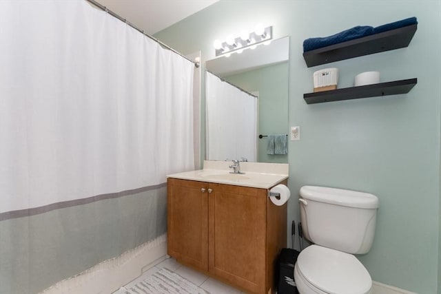 full bath with tile patterned floors, toilet, and vanity