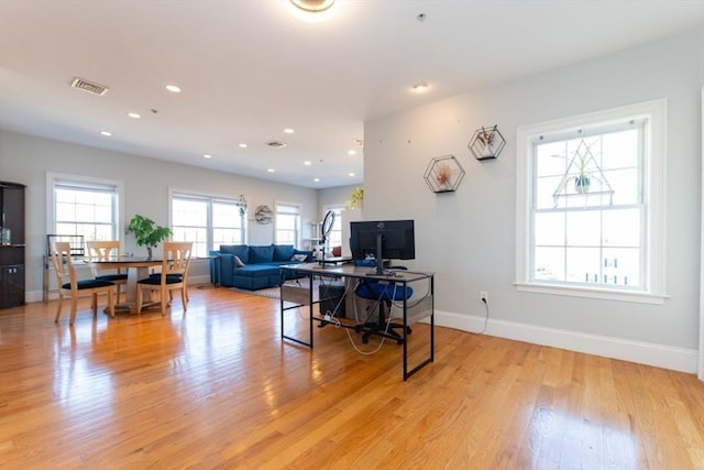 office featuring recessed lighting, visible vents, baseboards, and light wood-style floors