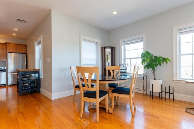 dining space with recessed lighting, light wood-style floors, visible vents, and baseboards