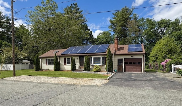 34 Pinecrest Rd, West Bridgewater, MA 02379 - single story home with an attached garage, driveway, solar panels, and a chimney
