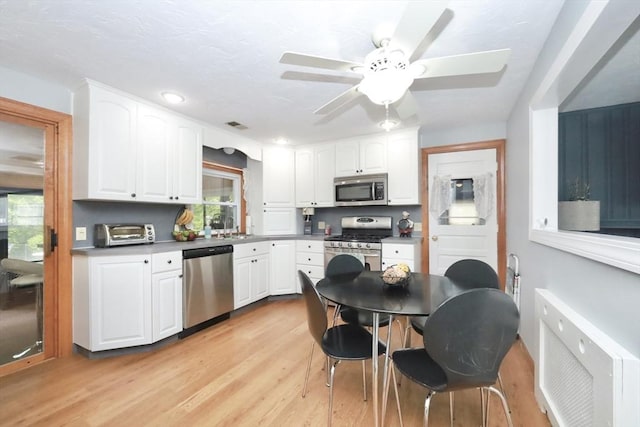 34 Pinecrest Rd, West Bridgewater, MA 02379 - kitchen with stainless steel appliances, healthy amount of natural light, and white cabinets