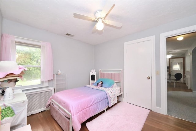 34 Pinecrest Rd, West Bridgewater, MA 02379 - bedroom with radiator heating unit, wood finished floors, and a ceiling fan