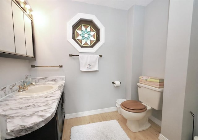 34 Pinecrest Rd, West Bridgewater, MA 02379 - half bath featuring toilet, wood finished floors, vanity, and baseboards