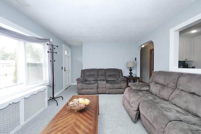34 Pinecrest Rd, West Bridgewater, MA 02379 - living area featuring arched walkways, carpet, and baseboards