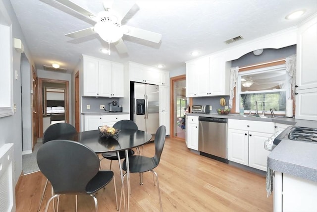 34 Pinecrest Rd, West Bridgewater, MA 02379 - kitchen with appliances with stainless steel finishes, a sink, a ceiling fan, white cabinets, and recessed lighting