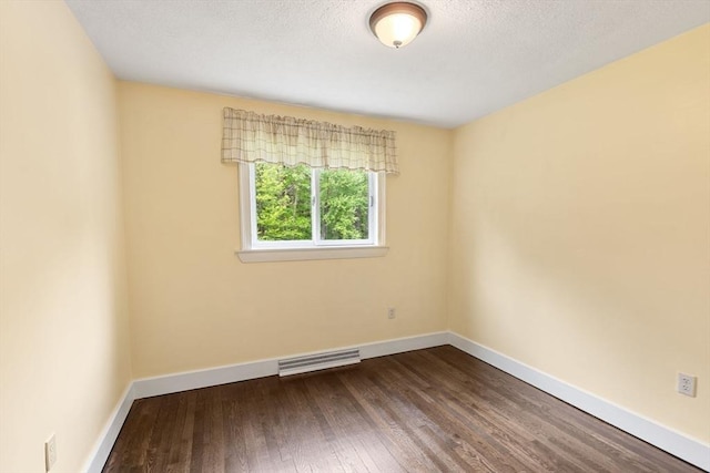 46 Blackmer, Sudbury, MA 01776 - unfurnished room with dark wood-style floors, baseboards, and a textured ceiling