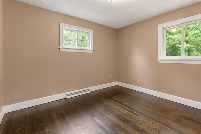 46 Blackmer, Sudbury, MA 01776 - empty room featuring baseboards, dark wood-style floors, and a textured ceiling