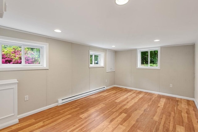 46 Blackmer, Sudbury, MA 01776 - below grade area with a baseboard radiator, light wood-style floors, baseboards, and recessed lighting