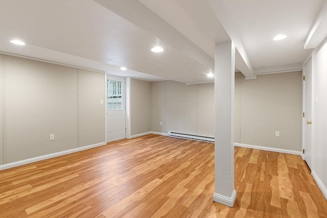 46 Blackmer, Sudbury, MA 01776 - basement featuring a baseboard heating unit, light wood-type flooring, baseboards, and recessed lighting