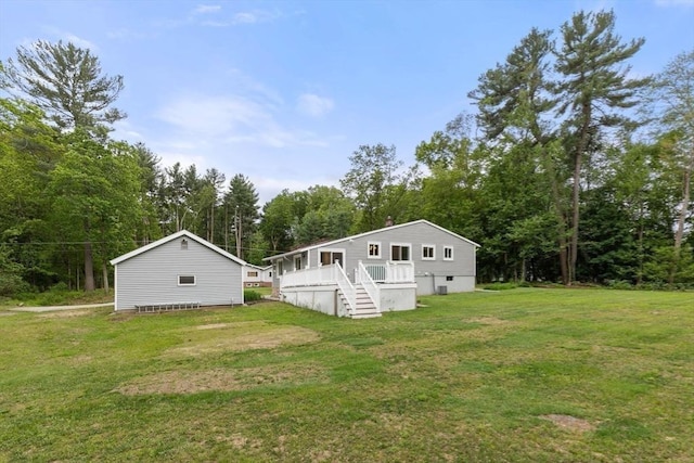 46 Blackmer, Sudbury, MA 01776 - view of side of home with stairs, a yard, a deck, and view of wooded area