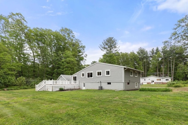 46 Blackmer, Sudbury, MA 01776 - rear view of property with a yard, a deck, and view of scattered trees