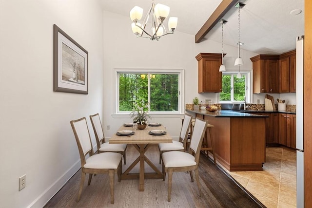 46 Blackmer, Sudbury, MA 01776 - dining space featuring a chandelier, baseboards, and light wood finished floors