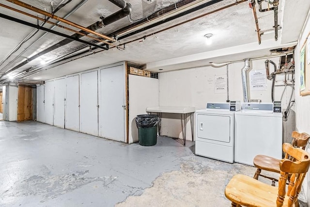 unfinished basement featuring separate washer and dryer