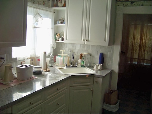 kitchen with sink and decorative backsplash