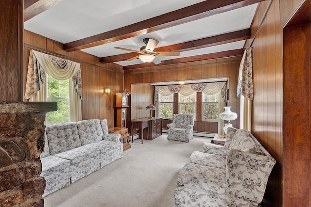 74 W Main St, Westminster, MA 01473 - living room featuring carpet, wood walls, beamed ceiling, ceiling fan, and a baseboard heating unit