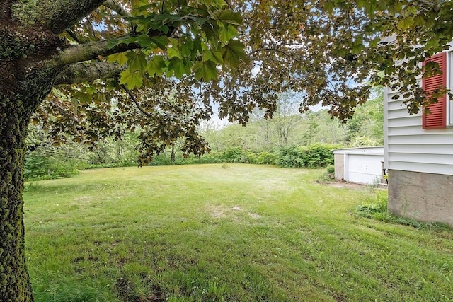 74 W Main St, Westminster, MA 01473 - view of green lawn with a garage