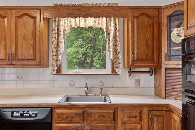 74 W Main St, Westminster, MA 01473 - kitchen with black dishwasher, light countertops, brown cabinets, and tasteful backsplash