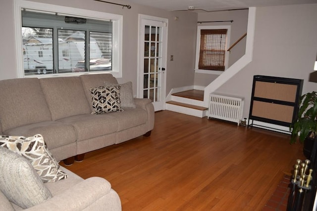 living room featuring radiator heating unit and wood-type flooring