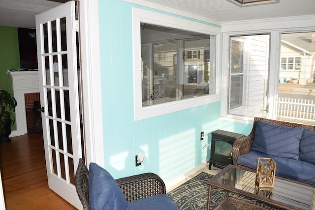 sunroom / solarium featuring french doors