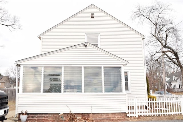 view of side of home with a sunroom