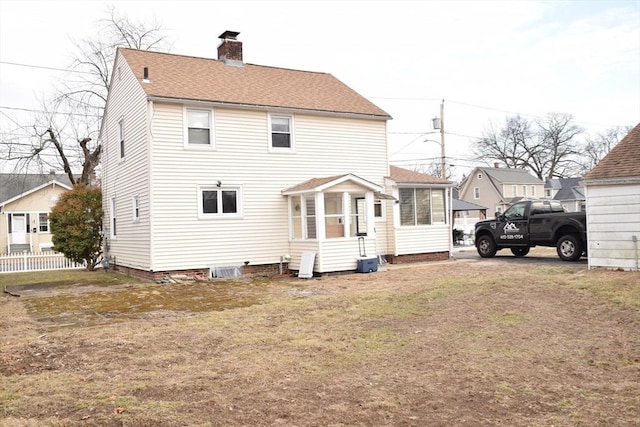 back of house with a yard