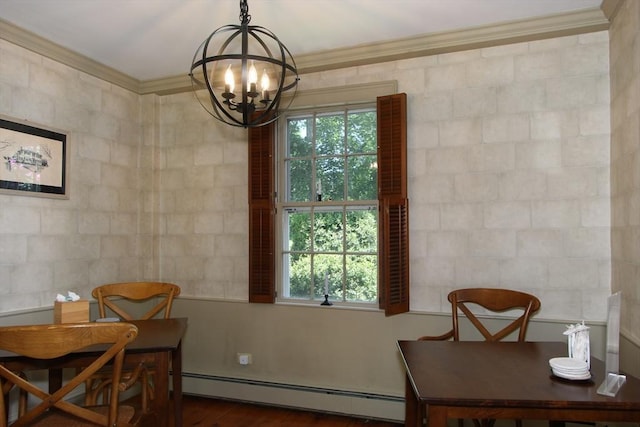 dining area featuring dark hardwood / wood-style floors, an inviting chandelier, baseboard heating, and crown molding