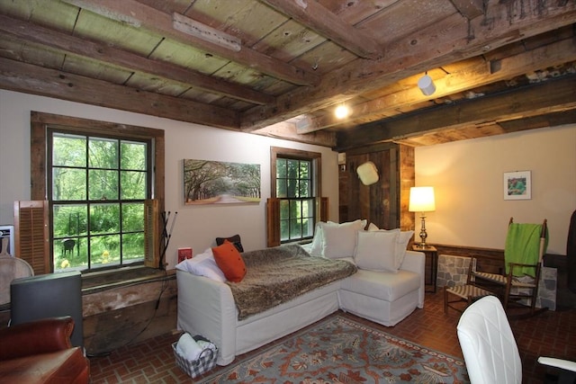 bedroom with beamed ceiling and wood ceiling