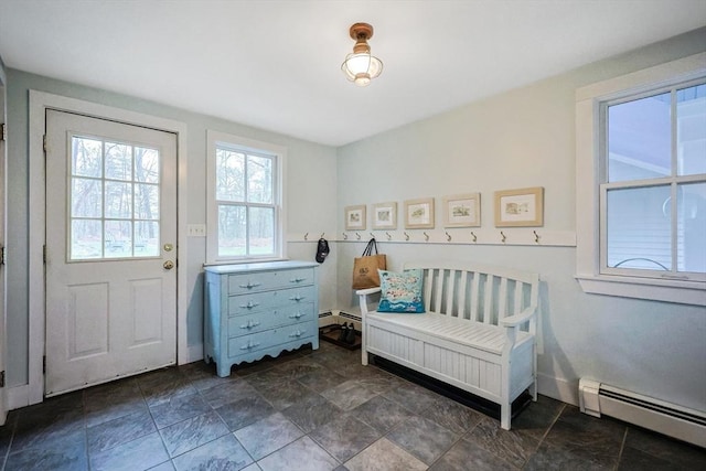 bedroom featuring baseboard heating, a baseboard heating unit, and baseboards