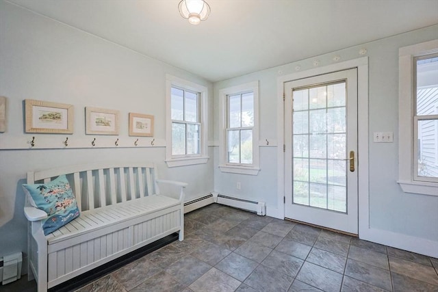 doorway to outside with a baseboard heating unit, baseboards, and plenty of natural light