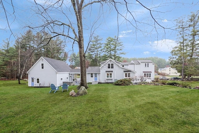 back of house with a yard