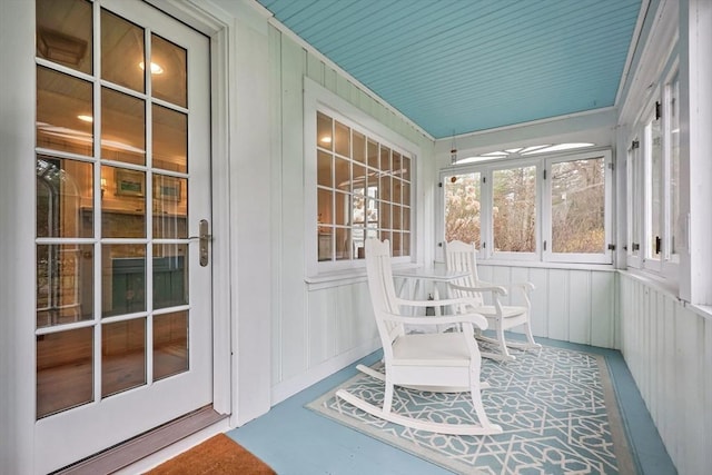 sunroom / solarium with concrete floors