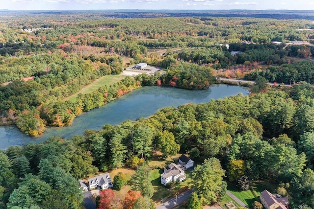 aerial view with a wooded view and a water view