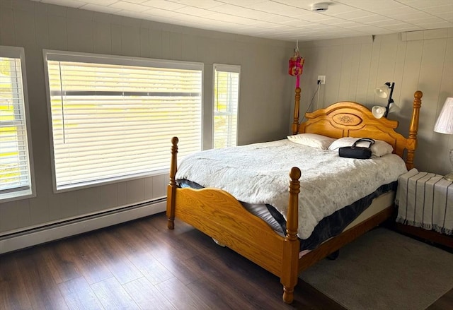 626 Nashua Rd, Dracut, MA 01826 - bedroom with wood finished floors, baseboard heating, and multiple windows