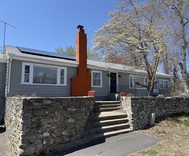 626 Nashua Rd, Dracut, MA 01826 - ranch-style house featuring a chimney and solar panels