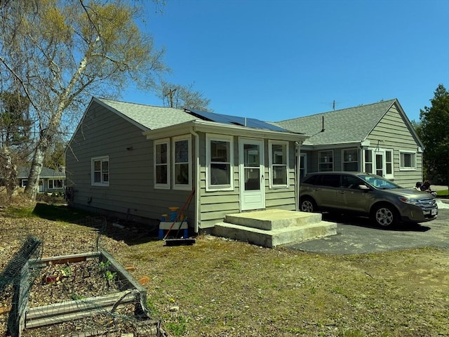 626 Nashua Rd, Dracut, MA 01826 - view of front facade with a garden and solar panels